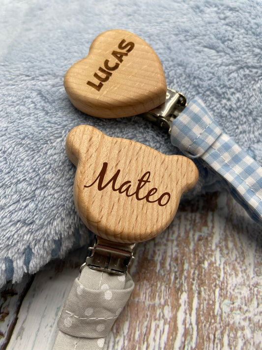 Personalized wooden and fabric pacifier holder.